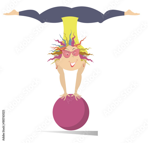 Smiling young woman do exercises with the ball isolated. Funny young woman standing legs up on theball on the hands and looks healthy and happy
