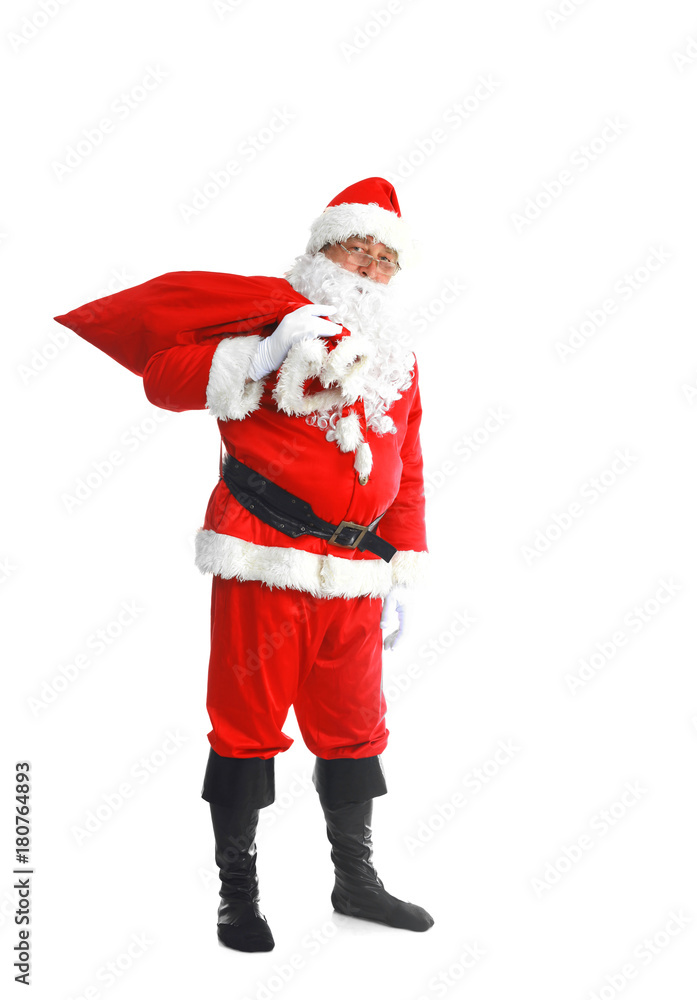 Real Santa Claus carrying big bag full of gifts, isolated on white background Real Santa Claus carrying big bag full of gifts, isolated on white background