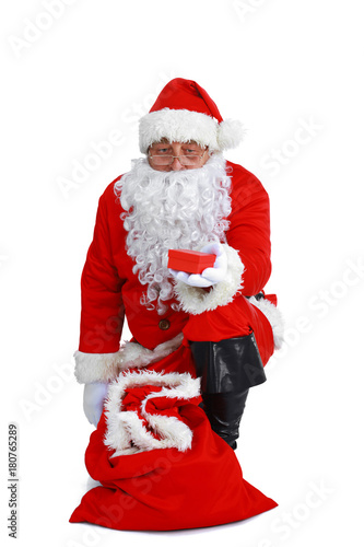 Santa Claus with Christmas Gift, isolated on white background