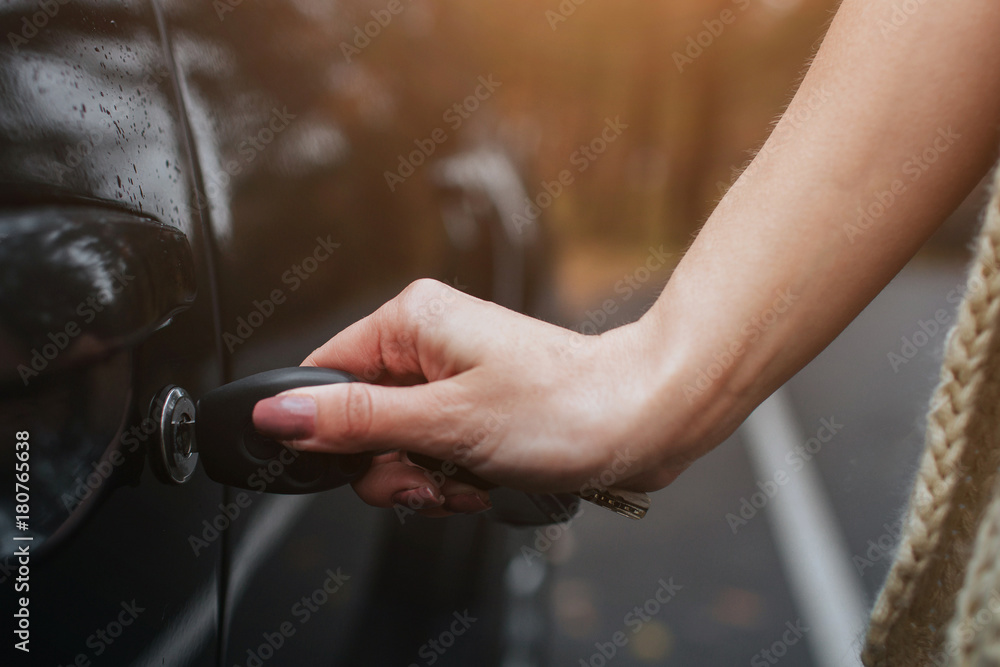 Woman holding car keys. Close up Hand