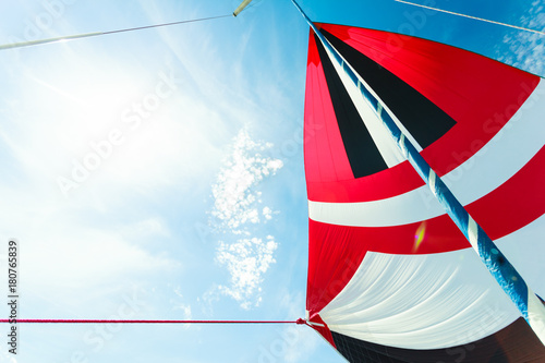 Spinnaker with uphaul, blue sky in background. photo