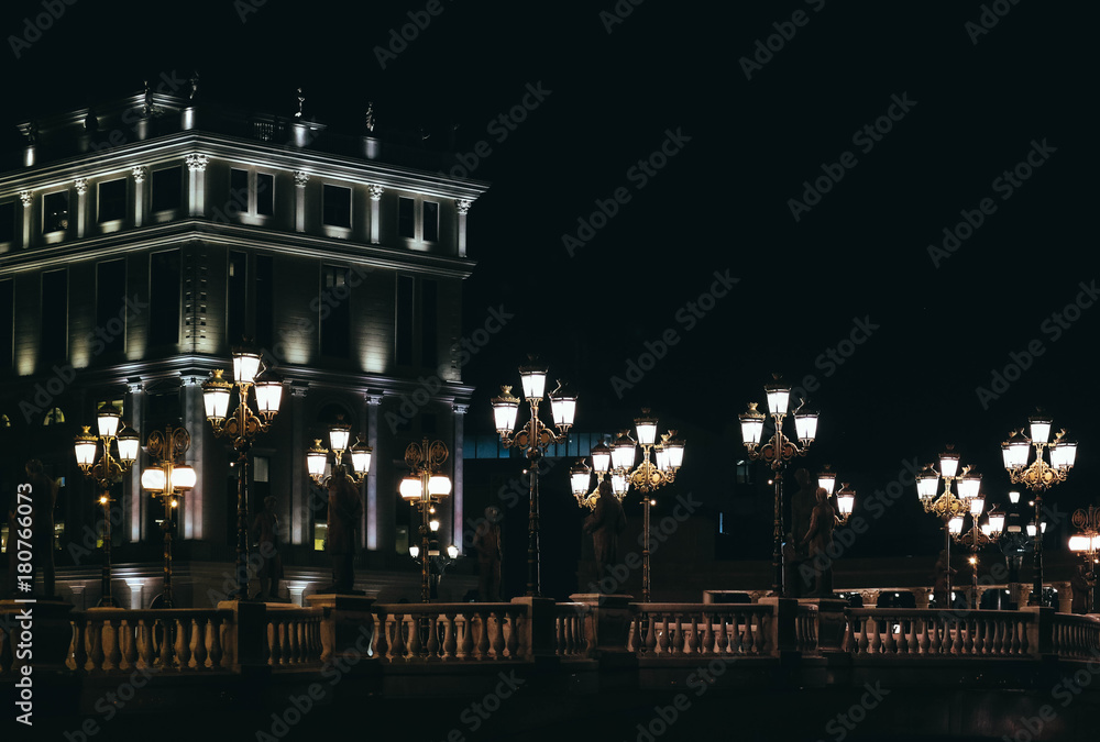 Skopje, Macedonia, Art Bridge at Night. European city architecture, famous bridge with sculptures.