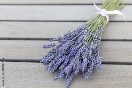 Lavender bouquet on a wooden table, shallow depth of field