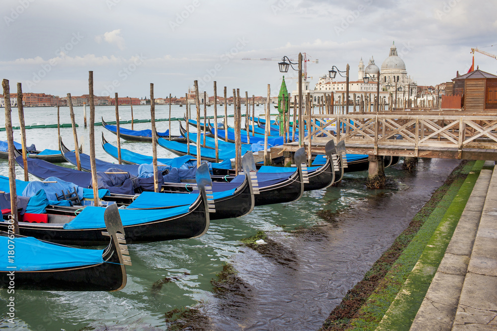 Venetian gondola and Cathedral of Santa Maria del Salute in Venice Italy
