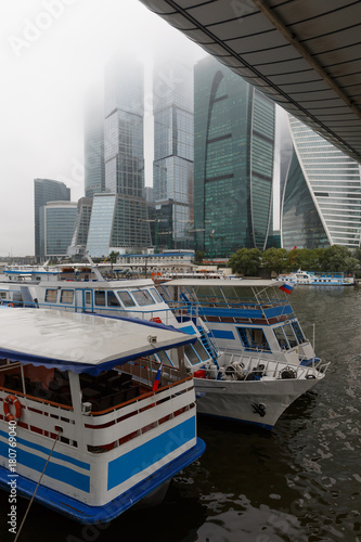 Passenger boats under the bridge near Moscow city