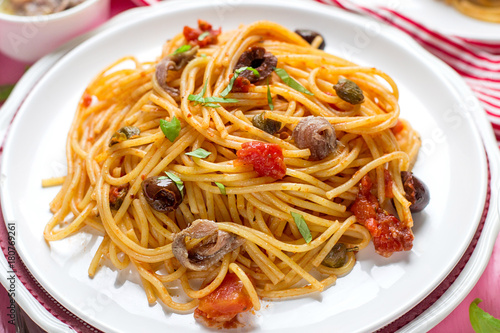 Pasta with tomatoes, olives, capers and anchovies Spaghetti alla puttanesca