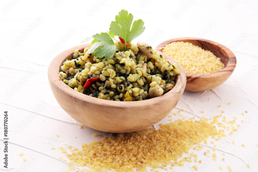 Bowl with homemade Bulgur Salad with parsley. Bowl with homemade Bulgur Salad with parsley.