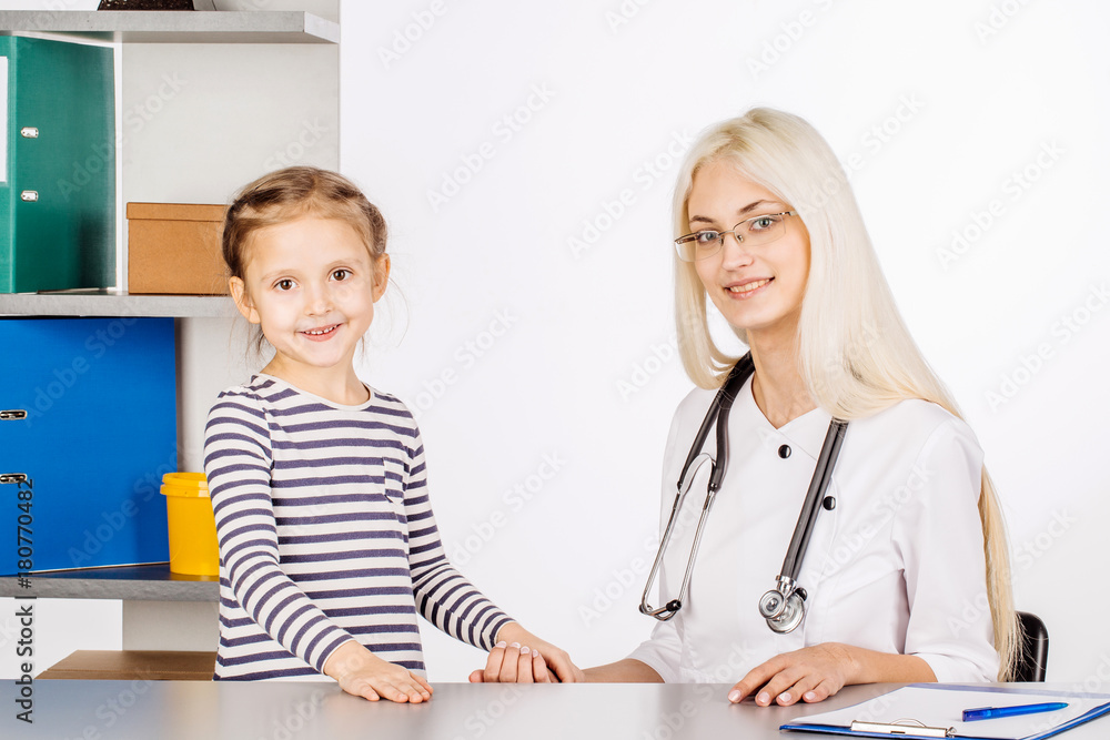 doctor examining a child girl in a hospital doctor examining a child girl in a hospital