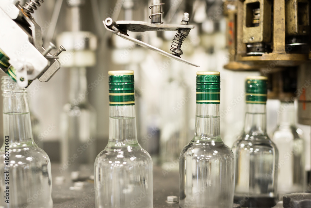 Bottles with a drink closed with a screw cap. Bottles with a drink closed with a screw cap.