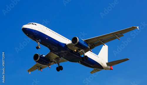 passenger airliner flying in sky towards destination