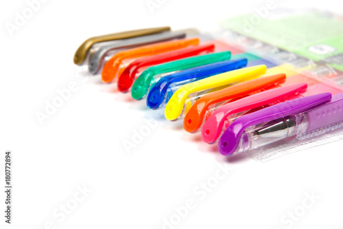 A set  colored pens on a white background