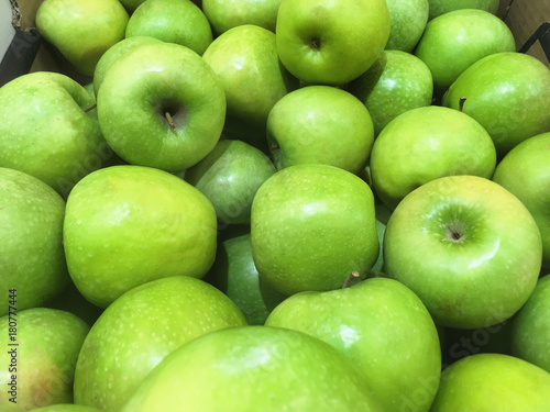 Green apple background in supermarket