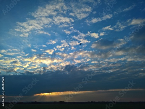 Sunset sky with scattered clouds