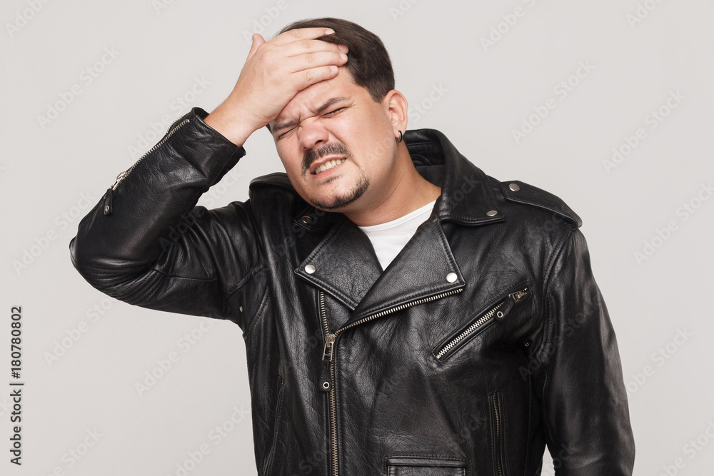 Distressed man have a problem. Touching head and have headache Distressed man have a problem. Touching head and have headache