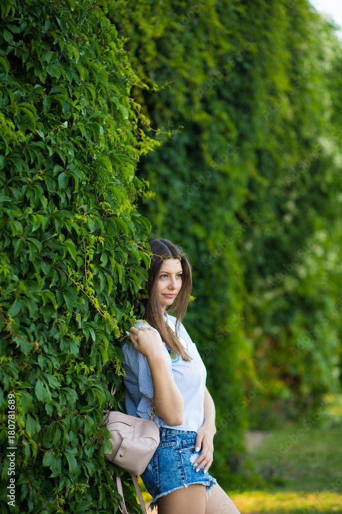 Cute young woman near city park tree Cute young woman near city park tree