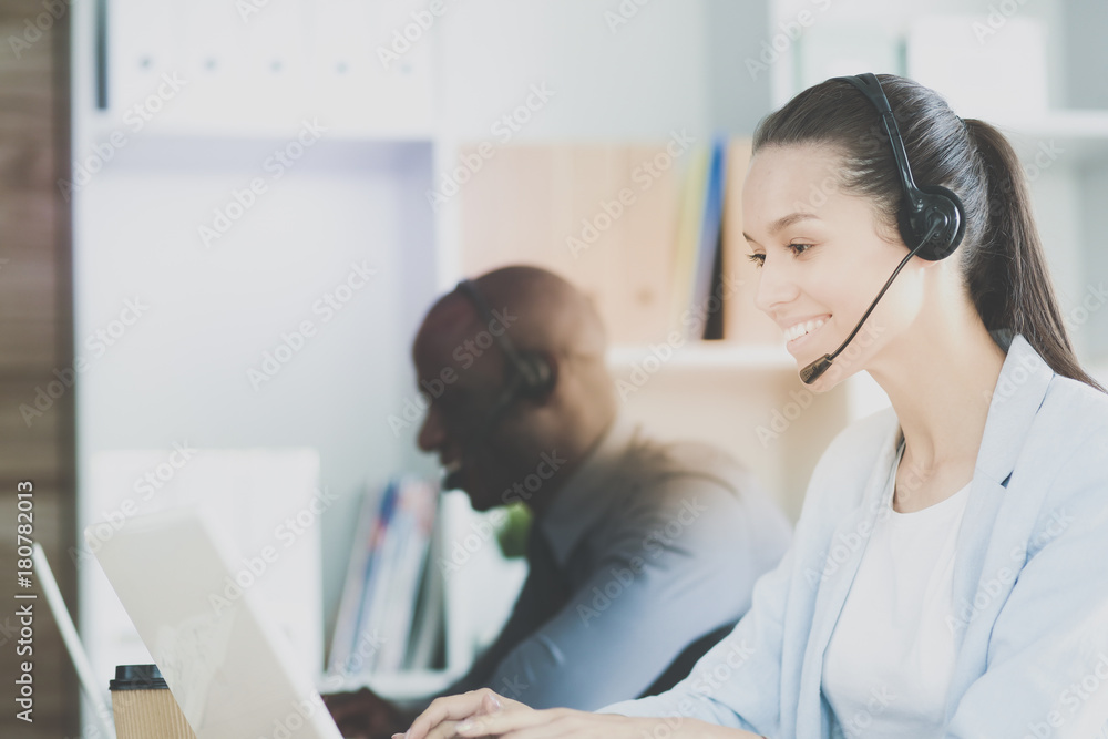 Portrait of an African American young business man with headset. Portrait of an African American young business man with headset.