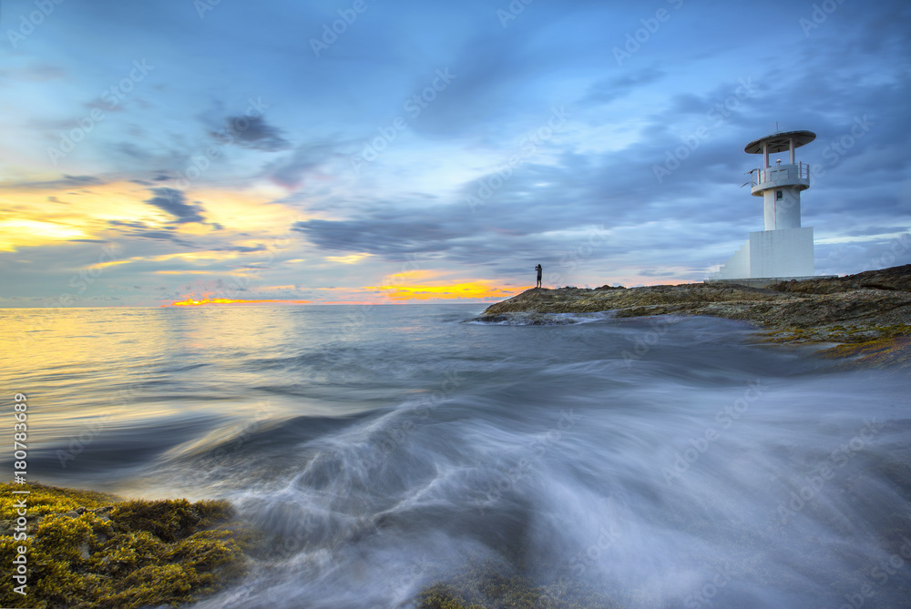 Sunset over the sea and lighthouse. Province Phang Nga , Khao Lak in Thailand Sunset over the sea and lighthouse. Province Phang Nga , Khao Lak in Thailand