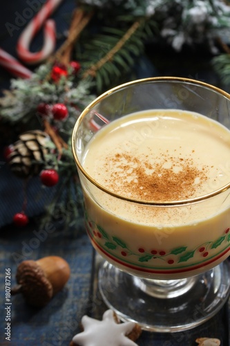 Eggnog - Xmas Holiday drink on festive blue background