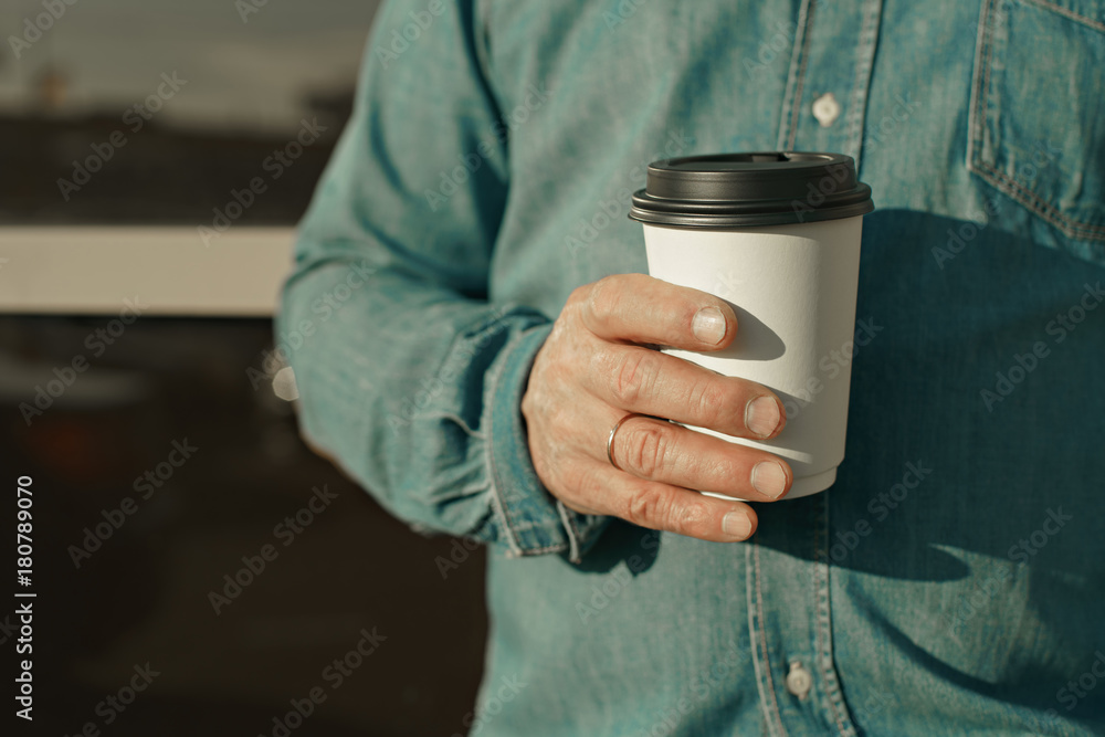 old man with beard and coffee in hand old man with beard and coffee in hand