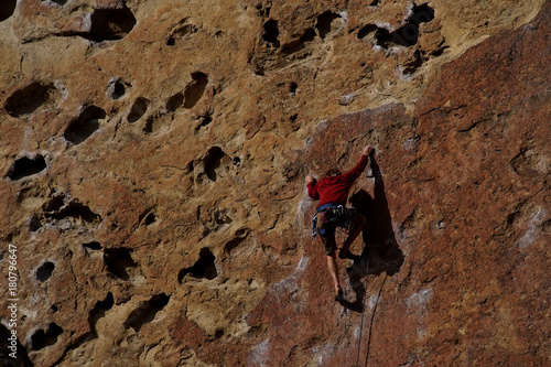 Rock climber on steep face