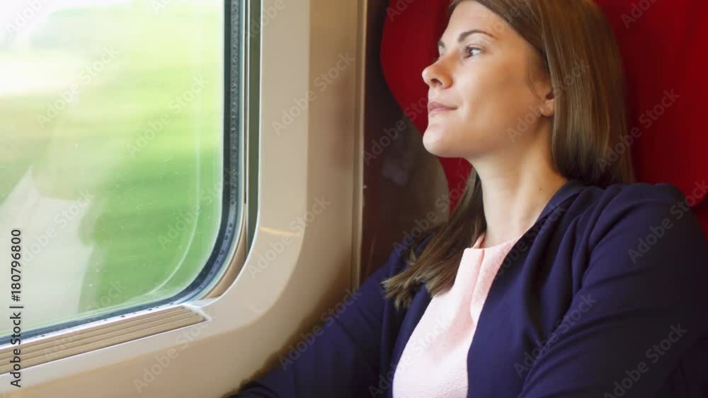 Woman tourist traveling in Europe by train. Young female relaxing sleeping in high-speed international train. Slight natural shaking Woman tourist traveling in Europe by train. Young female relaxing sleeping in high-speed international train. Slight natural shaking