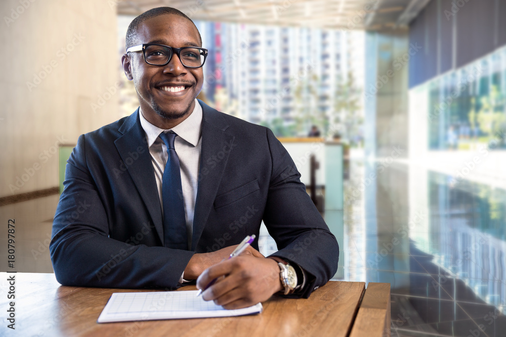 © elnariz - Elated enthusiastic business corporate executive with new job in financial management building taking notes © elnariz - Elated enthusiastic business corporate executive with new job in financial management building taking notes