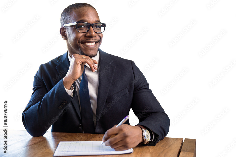 African american business man sitting at desk taking notes as an accountant financial representative African american business man sitting at desk taking notes as an accountant financial representative