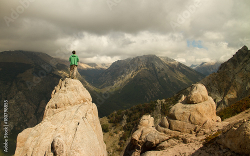 standing on top of a big rock