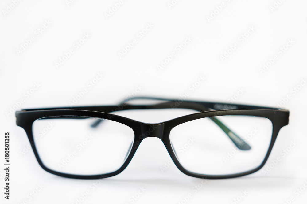 Front horizontal view of black designer glasses on white background, anti-reflective coating Front horizontal view of black designer glasses on white background, anti-reflective coating