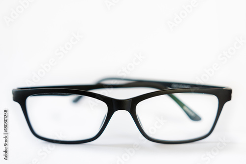 Front horizontal view of black designer glasses on white background, anti-reflective coating
