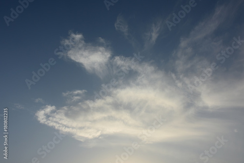 Fototapeta Naklejka Na Ścianę i Meble -  青空と雲「空想・雲のモンスター【モンスターの親（下）と飛び上がる子供のモンスター（上）などのイメージ）」（飛び跳ねる、子育て、親を踏み台にする、親のすねをかじる、楽しいなどのイメージ）