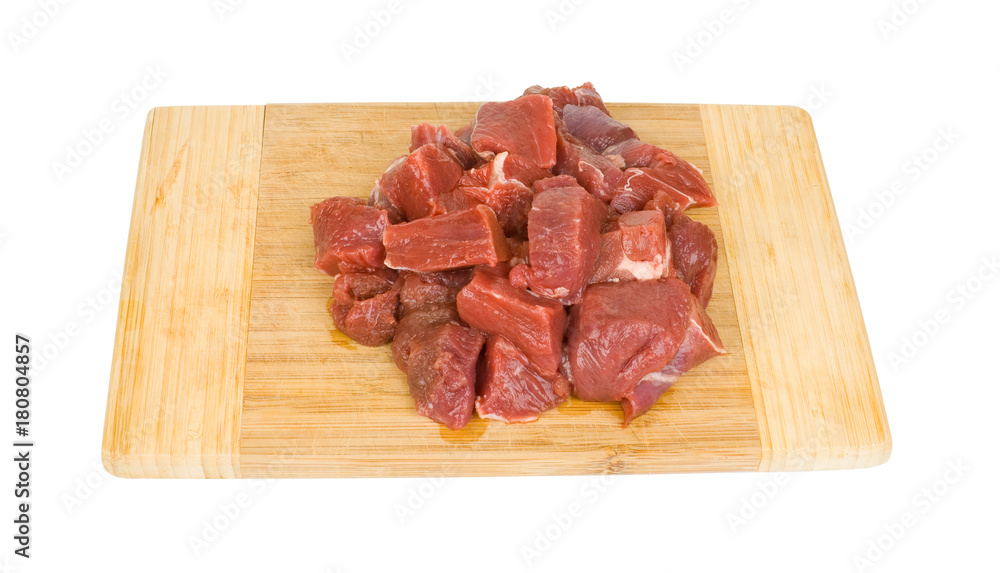 fresh meat on a wooden cutting board isolated on white background fresh meat on a wooden cutting board isolated on white background