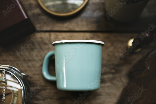 Aerial view of blue cup on wooden table