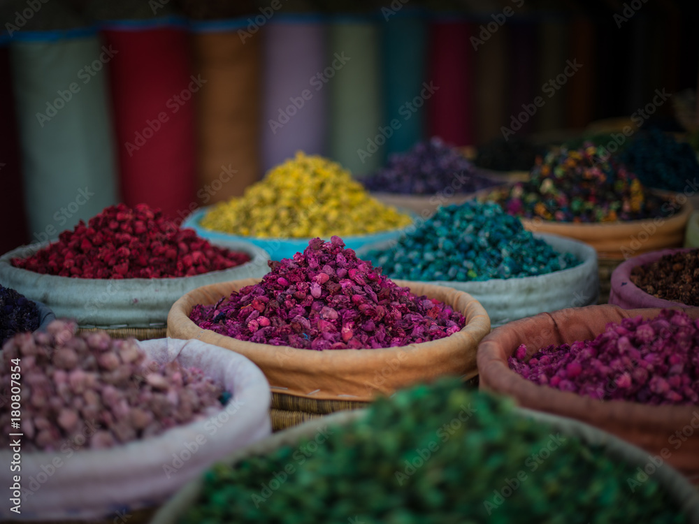 Piles of colourful, vibrant herbs and potpourri in a market stall in a souk in Marrakech, Morocco Piles of colourful, vibrant herbs and potpourri in a market stall in a souk in Marrakech, Morocco