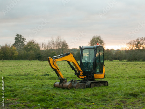 industry construction environment yellow digger machine parked o