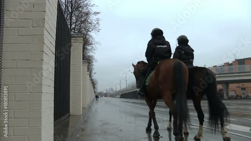 Mounted police patrolling the city.