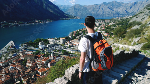 Photos Young teen admires the view during the ascent to the fortress in Kotor in Montenegro