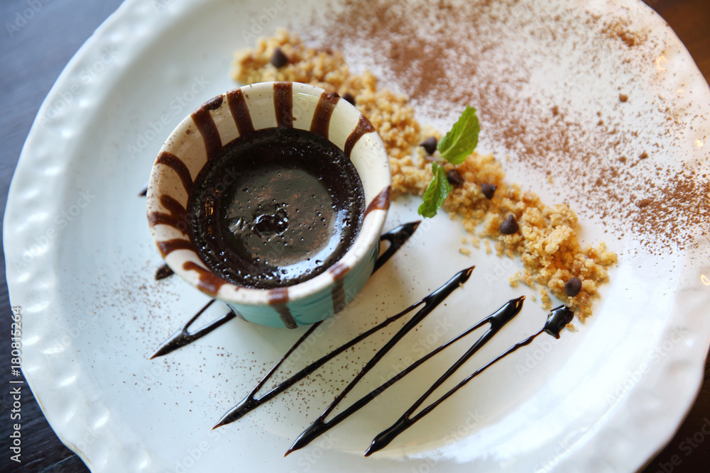 Fototapeta premium Chocolate lava cake on wood background