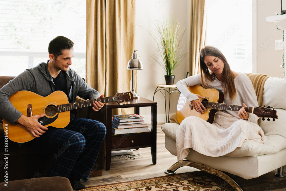 Couple playing guitar together Stock Photo | Adobe Stock