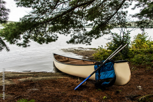 Canada Ontario Lake of two rivers white blank Canoe Canoes parked on island in Algonquin National Park photo