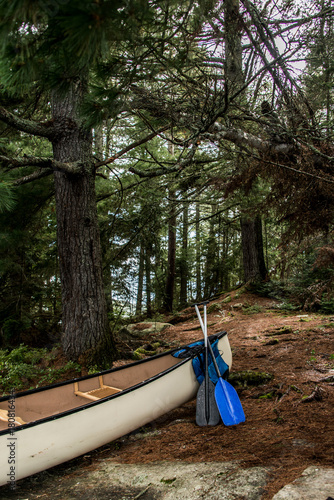 Canada Ontario Lake of two rivers white blank Canoe Canoes parked on island in Algonquin National Park photo