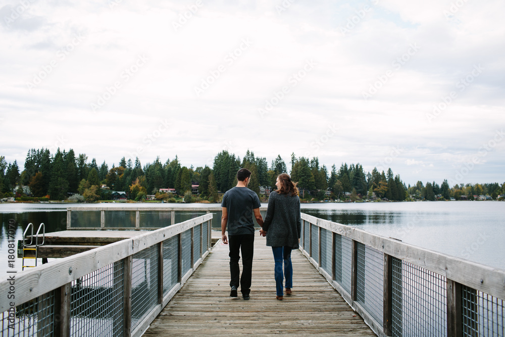 Couple walking on the pier