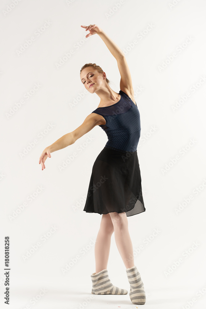 ballerina in a classical rack demonstrates a beautiful arm bend ballerina in a classical rack demonstrates a beautiful arm bend