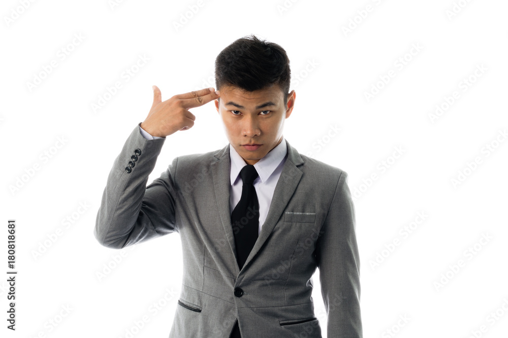 Portrait of a business man gesturing gun pointing to his head. Isolated on white background Portrait of a business man gesturing gun pointing to his head. Isolated on white background