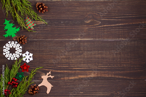 Christmas and New Year background. Winter holidays concept with decorations on wooden background. View from above, top studio shot, horizontal