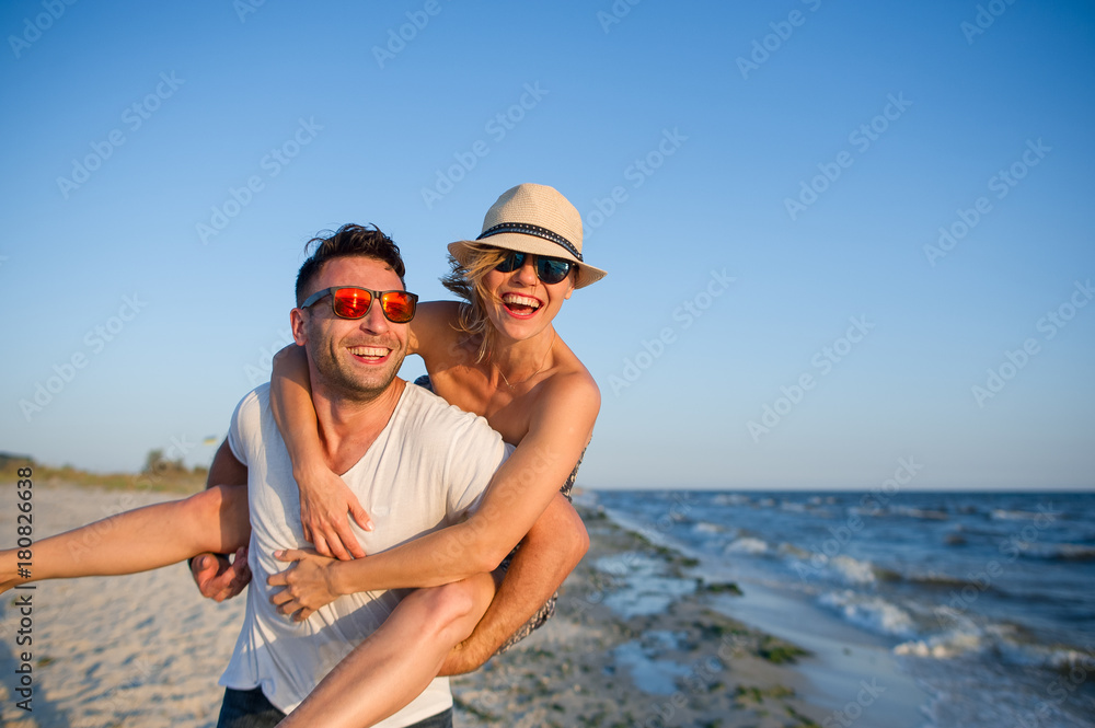 Young man holds on hands beautiful young woman. Young man holds on hands beautiful young woman.