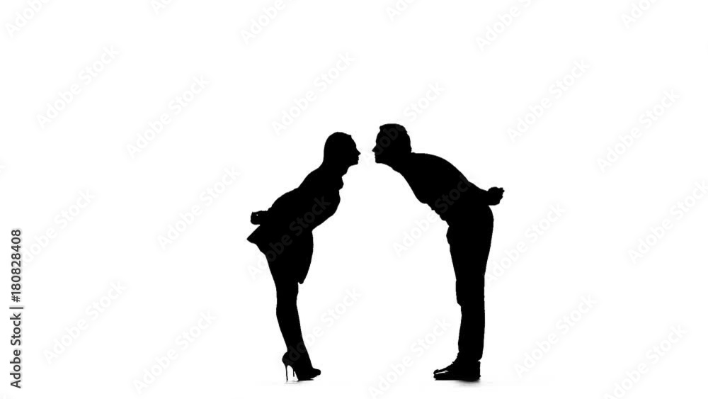 Pair of lovers kissing. White background. Silhouette. Slow motion Pair of lovers kissing. White background. Silhouette. Slow motion