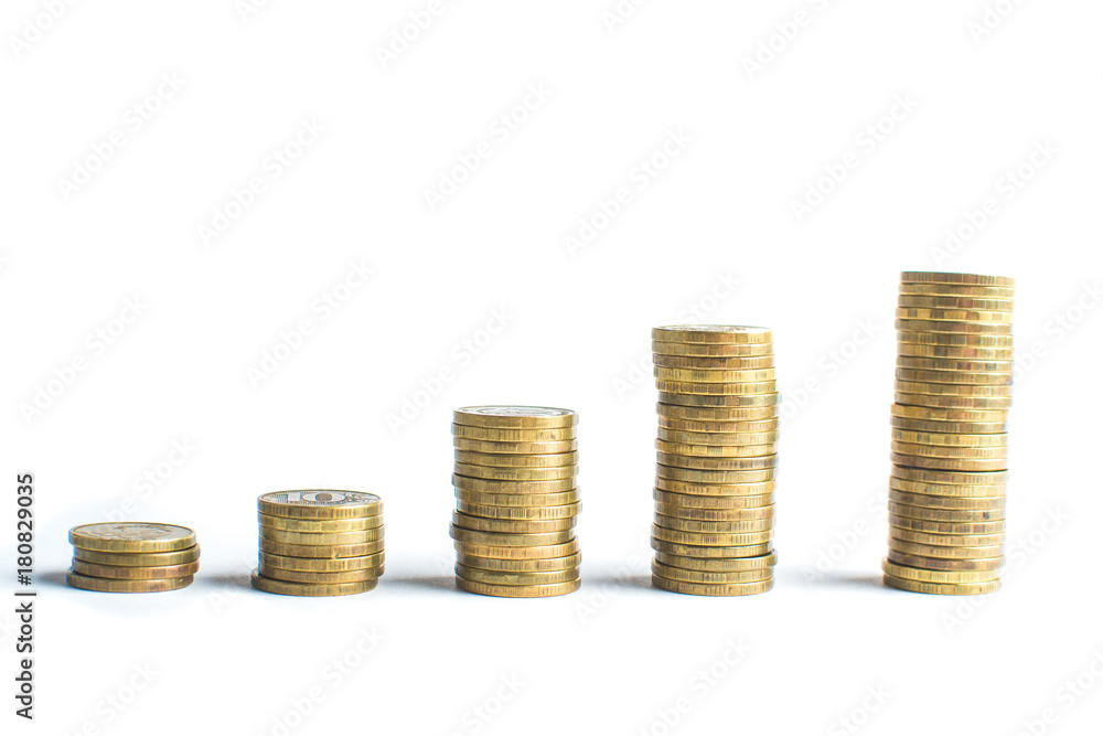 Coin stacks on white background different heights Coin stacks on white background different heights
