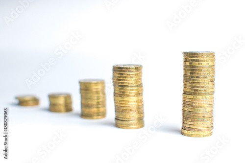 Coin stacks on white background different heights