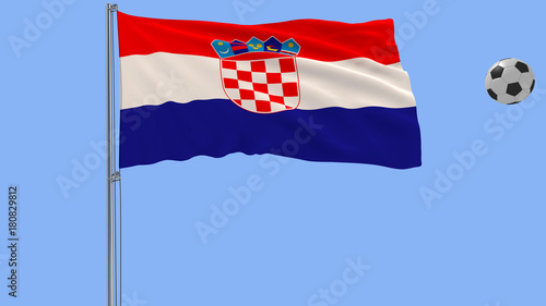 Realistic fluttering flag of Croatia and soccer ball flying around on a blue background, 3d rendering. photo